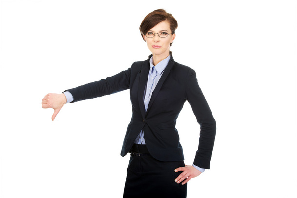 Business woman showing thumbs down. - 写真・画像
