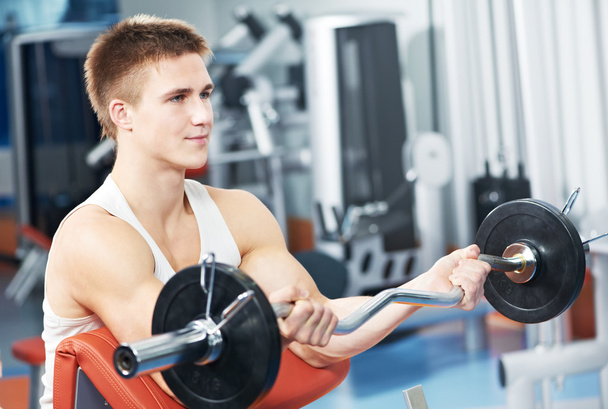 Bodybuilder man workout biceps muscle exercises - Foto, Imagen