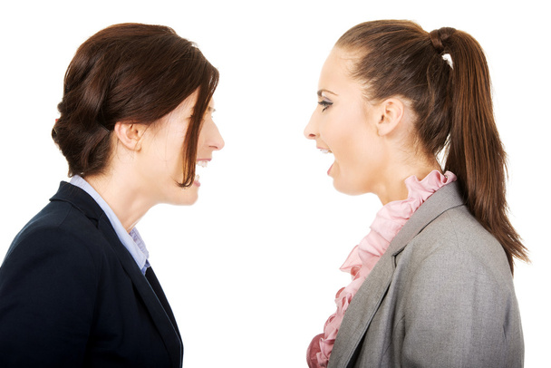 Angry businesswomans screaming at each other. - Фото, изображение