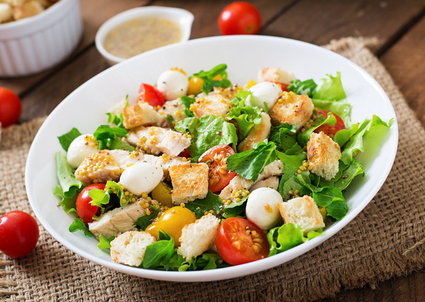 Salad with chicken, mozzarella and  tomatoes - Фото, изображение