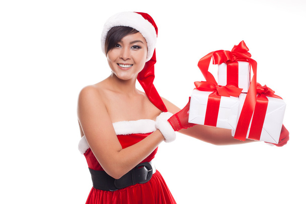 Santa hat Christmas woman holding christmas gifts smiling happy - Fotoğraf, Görsel