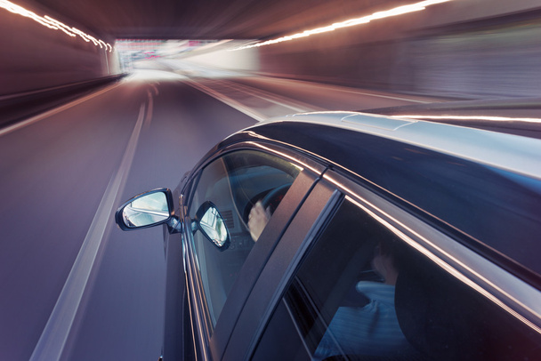 Car driving through a tunnel - Foto, afbeelding