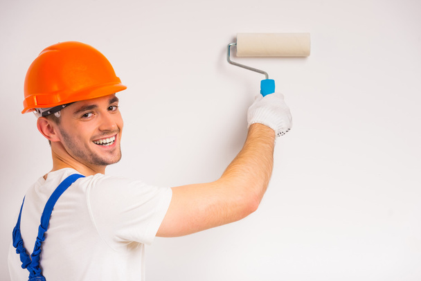 Male repairs indoors - Фото, изображение
