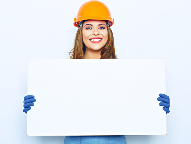 female builder holding big board - Fotoğraf, Görsel