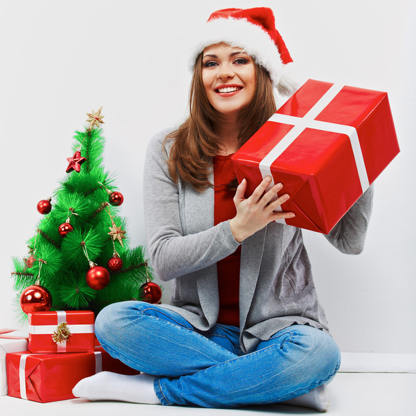 Santa girl with christmas gift - 写真・画像