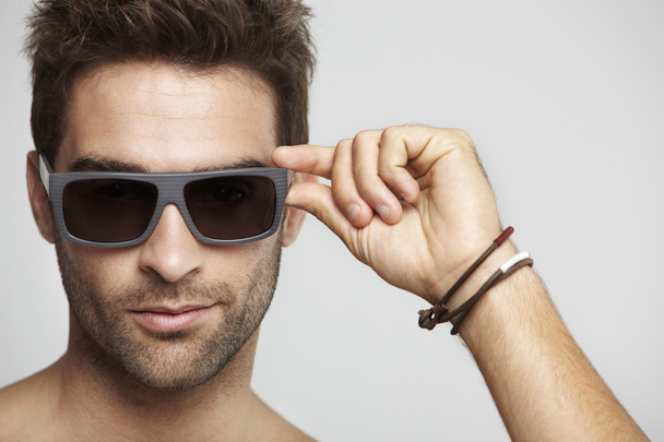 Male model posing in sunglasses - 写真・画像