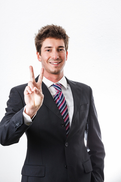 Young businessman showing gesture and facial expression - Foto, afbeelding