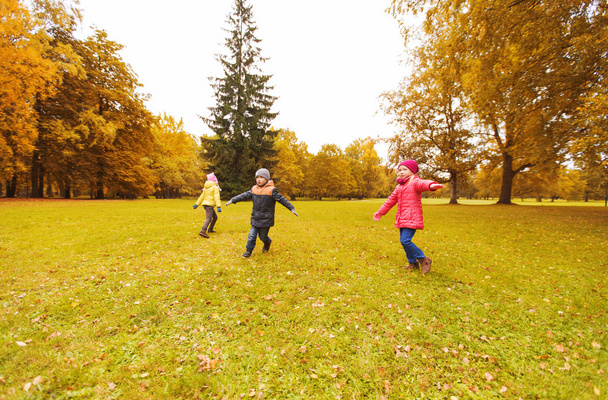 happy little children running and playing outdoors - Foto, Bild