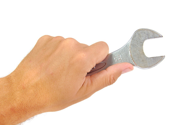 Wrench in hand on white background - Photo, Image