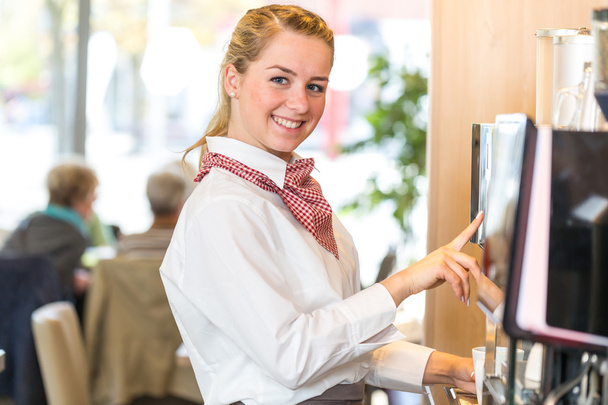 Waitress working at coffee machine in bakery or cafe - Foto, Imagen