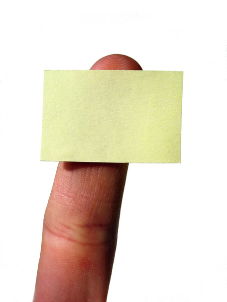 Палець тримає порожню жовту листівку
 - Фото, зображення