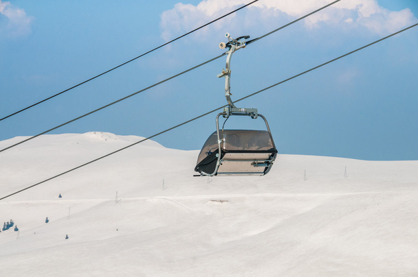 Ski lifts durings bright winter day - Fotó, kép