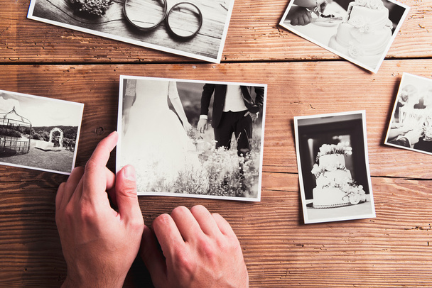 Wedding photos on a table - Фото, изображение