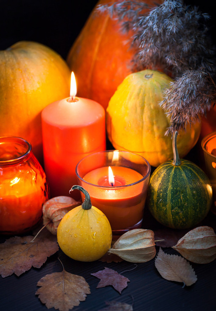 Pumpkins and candles - Фото, изображение