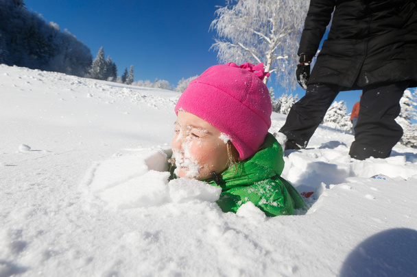 Child with face covered in fresh snow - Fotoğraf, Görsel