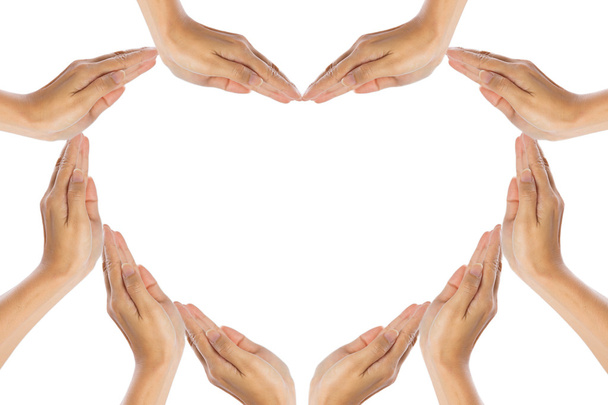 handen maken hart vorm op witte achtergrond - Foto, afbeelding