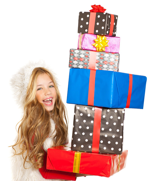 Kid little girl with christmas present gifts stacked - Foto, Bild