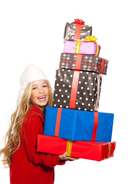 Kid girl holding many gifts stacked on her hand - Foto, Bild