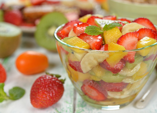 Fruit salad with mango and strawberries - Фото, изображение