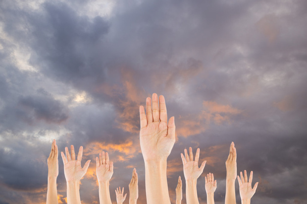 Diverse Raised Hands on sky background - Photo, Image