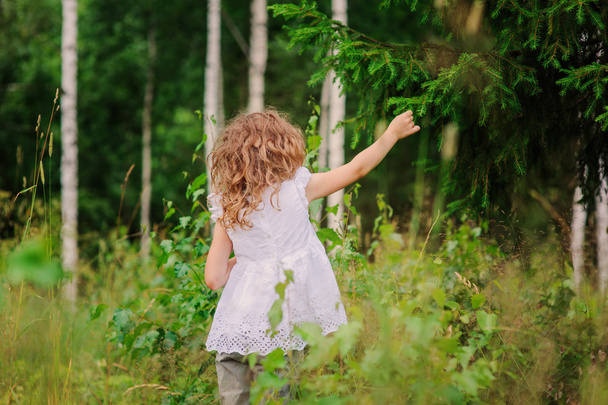 happy child girl in summer forest - Фото, изображение