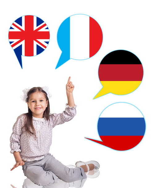 Mała dziewczynka i pęcherzyki z flagami państw. - Zdjęcie, obraz