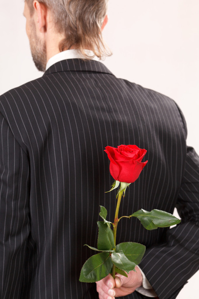 Man with red rose - Fotoğraf, Görsel