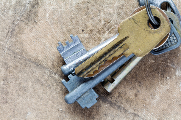 Old keys on dirty canvas - Фото, изображение