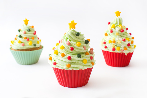 Cupcakes with Christmas tree shape on wood - Photo, Image