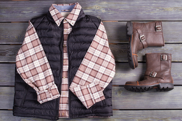 Beautiful men's checkered shirt with a waistcoat and leather boo - Photo, Image