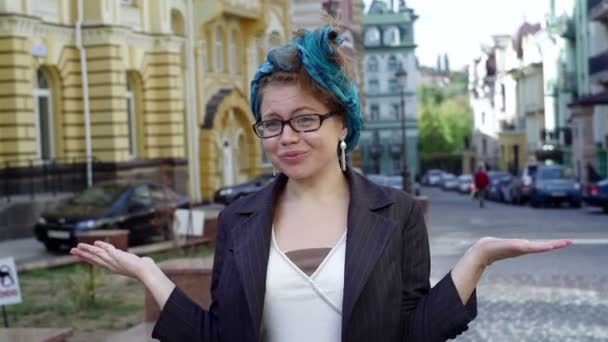 woman in glasses makes a surprised face - Кадри, відео