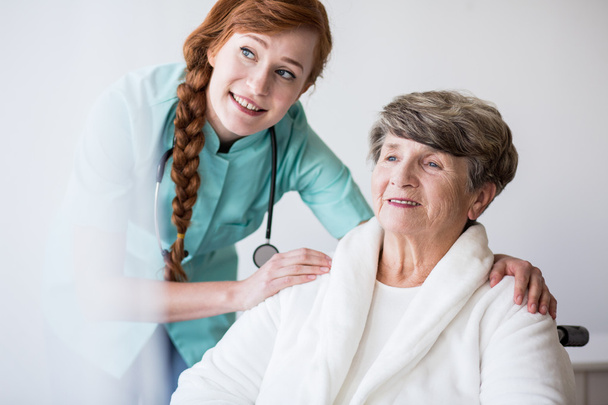 Young doctor and elderly patient - Photo, Image