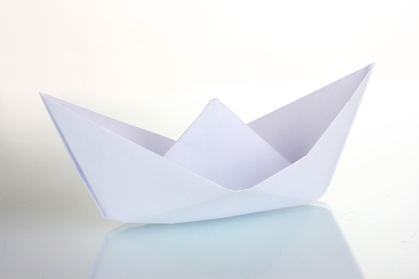 Origami paper boat isolated on white - 写真・画像