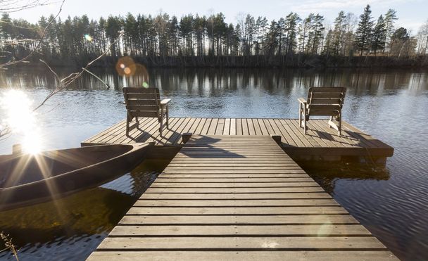 Two Chairs on Pier in River - Photo, Image