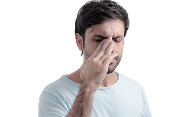 Sinus pain, sinus pressure, sinusitis. Sad man holding his nose - Foto, Imagem