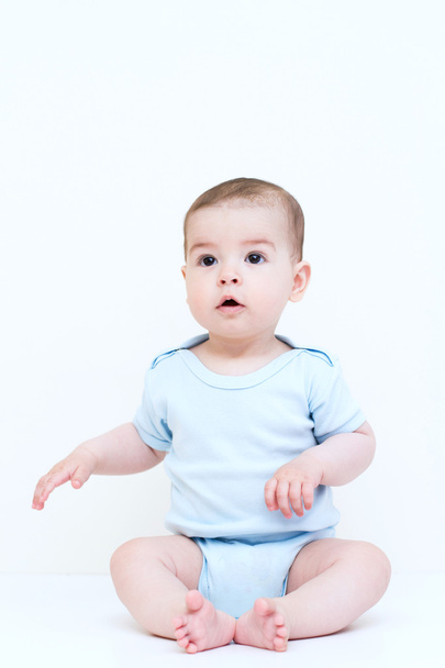 Sitting adorable baby on white background - Φωτογραφία, εικόνα