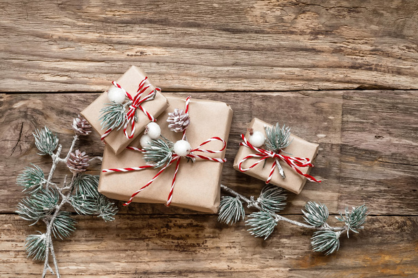 christmas gifts and decorations on wooden background - Fotó, kép