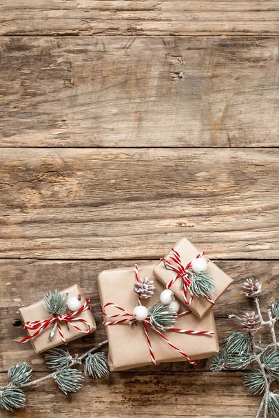 christmas gifts and decorations on wooden background - Fotografie, Obrázek