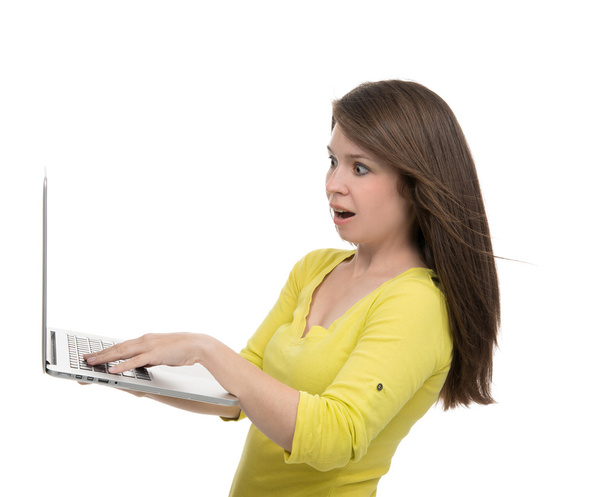 Young woman with new modern popular laptop keyboard with blank s - Foto, afbeelding