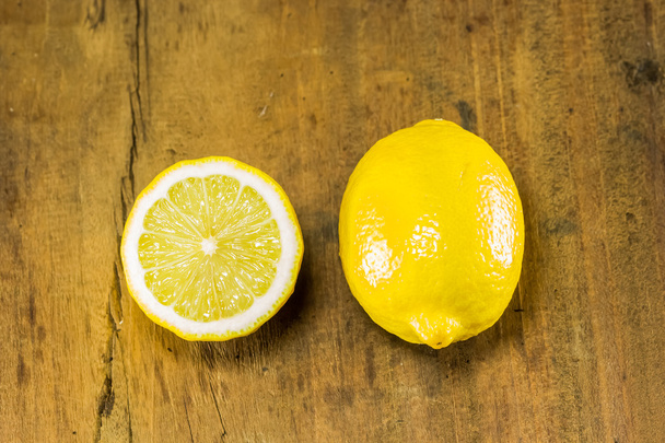 lemon and half on the wood background - Photo, Image