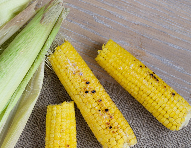 Grilled corn on a wooden surface - Photo, Image