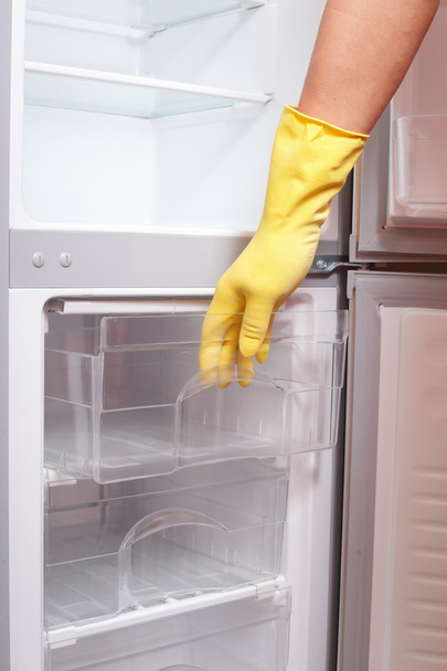 Hand opening refrigerator. - Zdjęcie, obraz