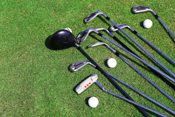 Different golf clubs  and balls - Fotó, kép