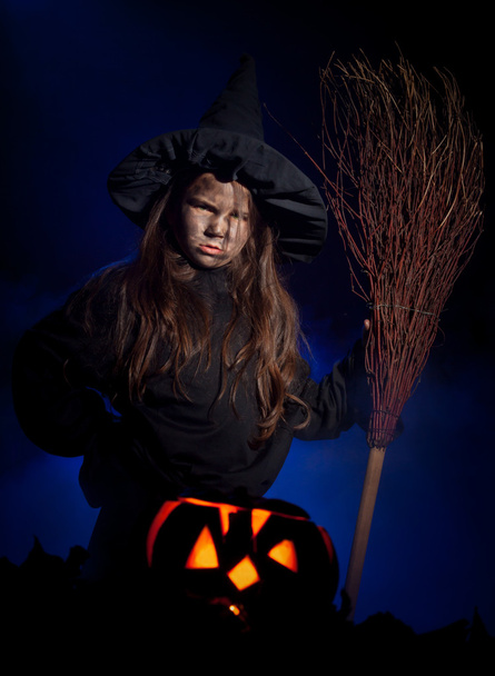 The little witch with halloween pumpkin - Photo, image