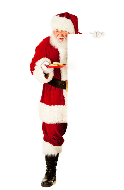 Santa: Estandes pelo cartão branco com placa de biscoitos
 - Foto, Imagem