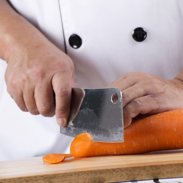 chef cortando cenoura
 - Foto, Imagem