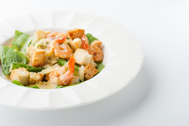 Caesar salad with shrimps on the white background horizontal - Fotoğraf, Görsel