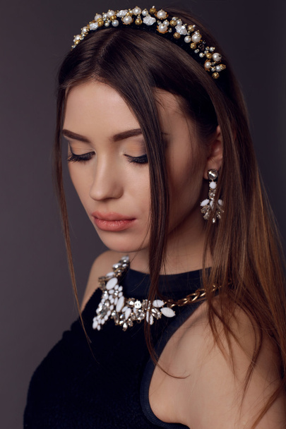 brunette woman with bright evening makeup with luxurious bijou - Fotografie, Obrázek