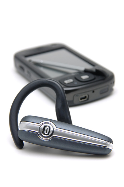Bluetooth headset a pda telefon - Fotografie, Obrázek