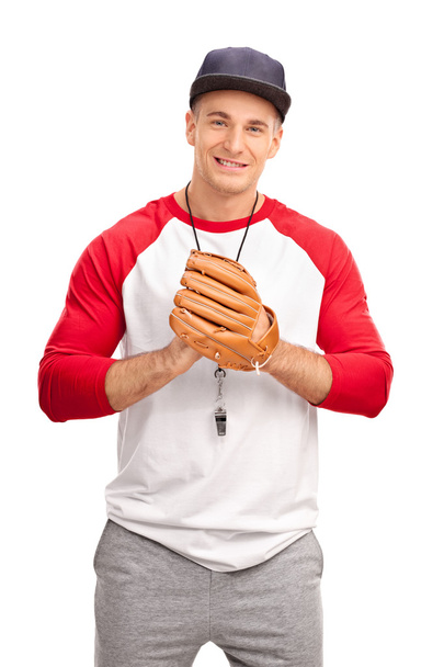 Young coach with a baseball glove  - 写真・画像